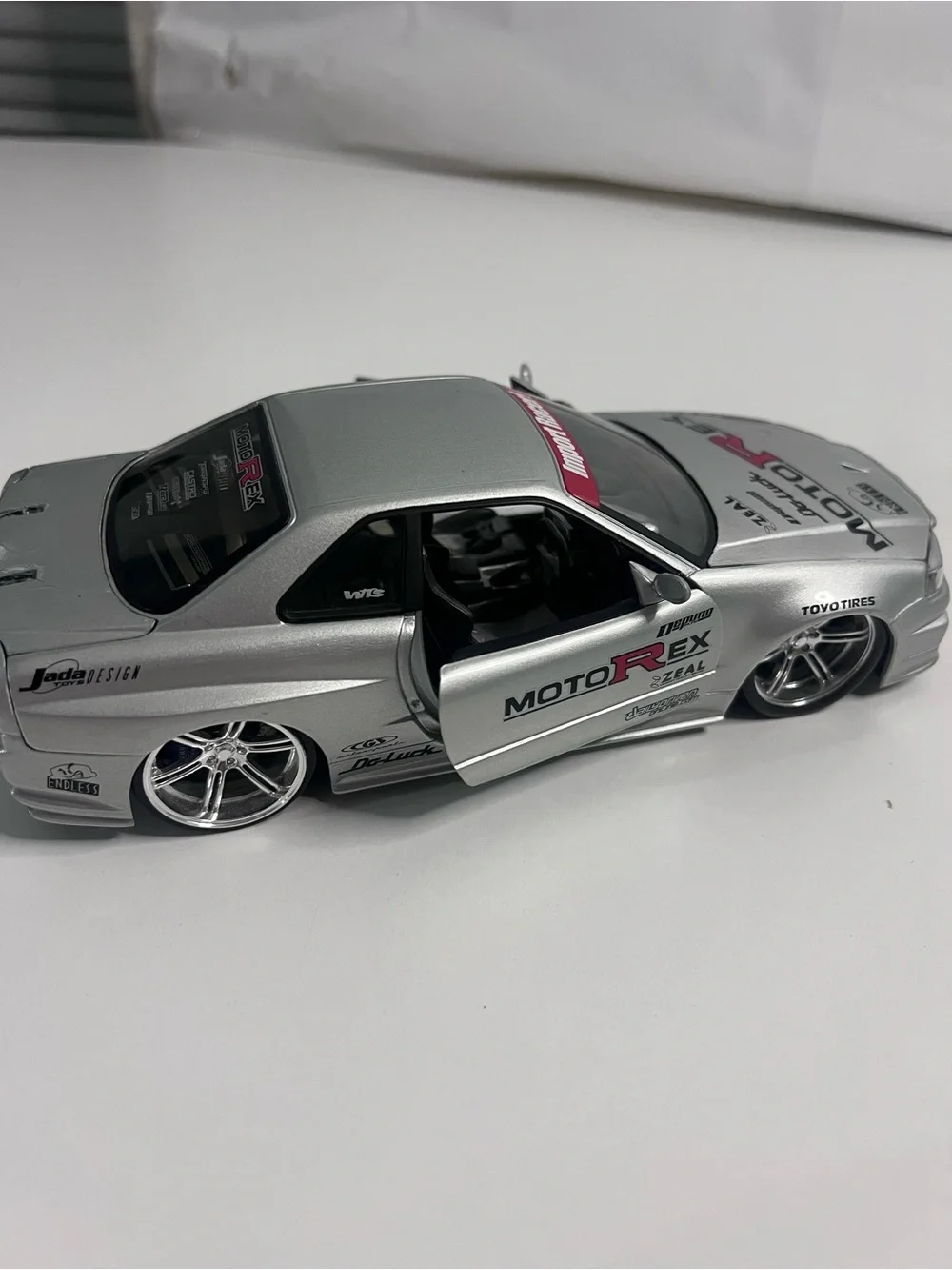 Nissan Skyline GT-R R34 Import Racer MotoRex Diecast 1:18 Escala - Coleccionable